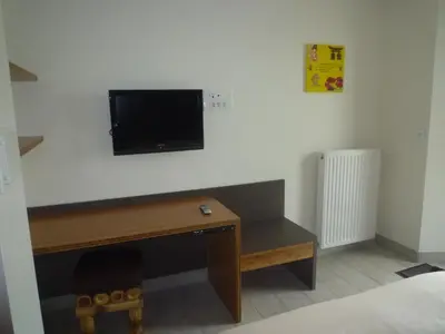 Télévision ou salle de divertissement dans l'établissement Domaine de Kerzuat