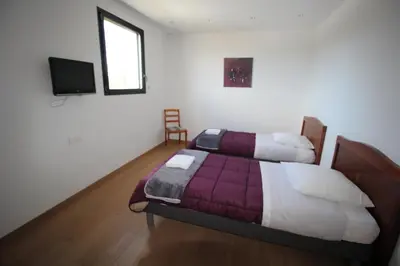 Un ou plusieurs lits dans un hébergement de l'établissement Contemporary Villa of Kerseal