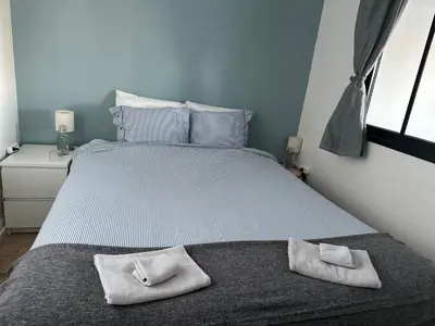 Un ou plusieurs lits dans un hébergement de l'établissement Appartement Design VII Port de Tréboul-Douarnenez