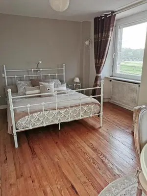 Un ou plusieurs lits dans un hébergement de l'établissement Chambres d'Hôtes vue mer entre Plestin les Grèves et locquirec