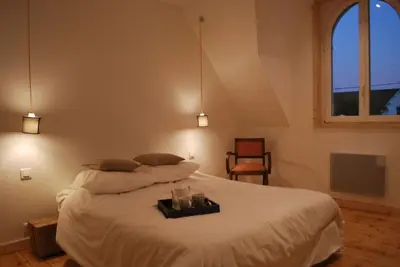 Un ou plusieurs lits dans un hébergement de l'établissement Maison de village, charme scandinave