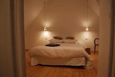 Un ou plusieurs lits dans un hébergement de l'établissement Maison de village, charme scandinave