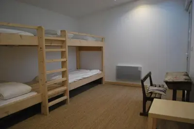 Un ou plusieurs lits dans un hébergement de l'établissement Maison de village, charme scandinave