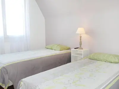 Un ou plusieurs lits dans un hébergement de l'établissement Holiday Home Sables Blancs by Interhome