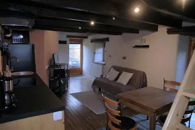 Coin salon dans l'établissement Au ptit gîte
