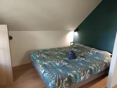 Un ou plusieurs lits dans un hébergement de l'établissement Appartement Studio Prieuré