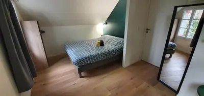 Un ou plusieurs lits dans un hébergement de l'établissement Appartement Studio Prieuré