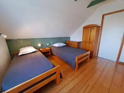 Un ou plusieurs lits dans un hébergement de l'établissement Holiday home close to beach, Cléder