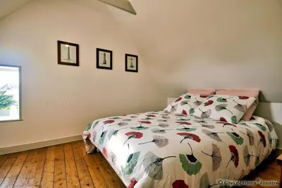 Un ou plusieurs lits dans un hébergement de l'établissement Gîte Le pied à terre