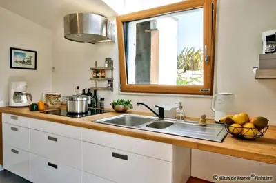 Cuisine ou kitchenette dans l'établissement Gîte Le pied à terre
