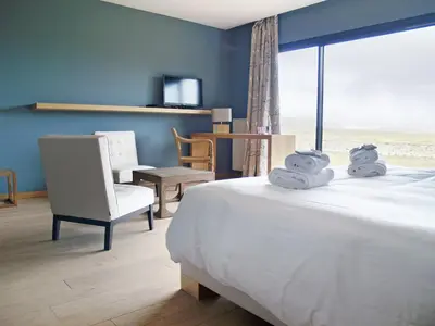 Un ou plusieurs lits dans un hébergement de l'établissement Logis Le Château de Sable