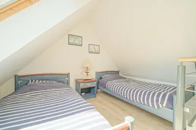 Un ou plusieurs lits dans un hébergement de l'établissement Ker Moumousse, Maison de famille, Côte de Granit Rose, 5 min plage