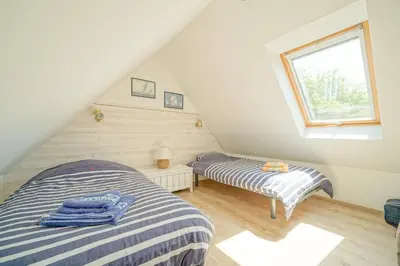 Un ou plusieurs lits dans un hébergement de l'établissement Ker Moumousse, Maison de famille, Côte de Granit Rose, 5 min plage