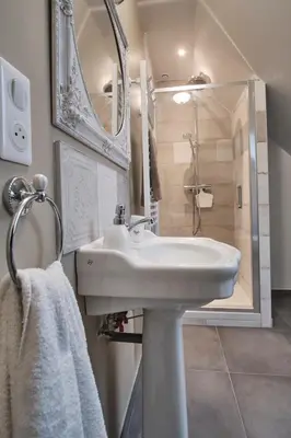 Salle de bains dans l'établissement A l'Ombre des Pommiers