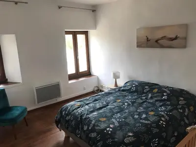 Un ou plusieurs lits dans un hébergement de l'établissement Charmante maison entre Terre et Mer