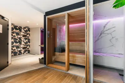 Un ou plusieurs lits dans un hébergement de l'établissement Le Cornouaille Hotel & Spa