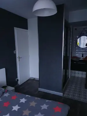 Un ou plusieurs lits dans un hébergement de l'établissement Chambre d hote avec sa SDB privative
