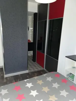 Un ou plusieurs lits dans un hébergement de l'établissement Chambre d hote avec sa SDB privative