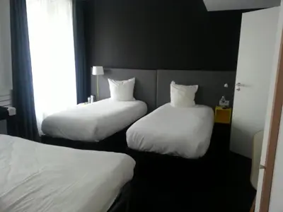 Un ou plusieurs lits dans un hébergement de l'établissement Kyriad Hotel Brest