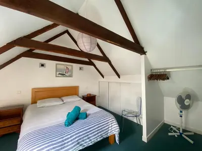 Un ou plusieurs lits dans un hébergement de l'établissement Sue's cottages