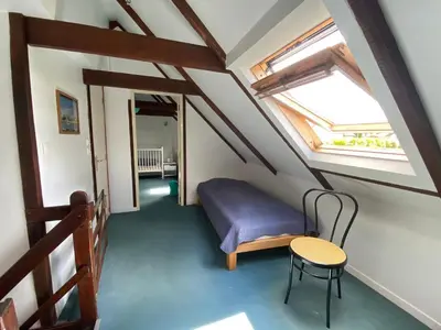 Un ou plusieurs lits dans un hébergement de l'établissement Sue's cottages