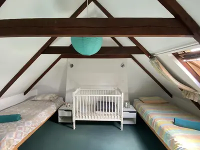 Un ou plusieurs lits dans un hébergement de l'établissement Sue's cottages