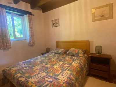 Un ou plusieurs lits dans un hébergement de l'établissement Sue's cottages