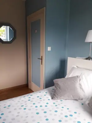 Un ou plusieurs lits dans un hébergement de l'établissement Chambre dans villa