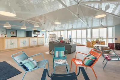 Coin salon dans l'établissement Résidence Pierre & Vacances Premium Le Coteau et la Mer