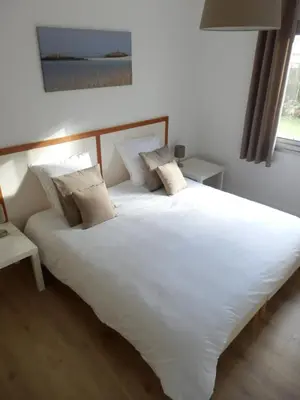 Un ou plusieurs lits dans un hébergement de l'établissement Villa à la croisée des baies