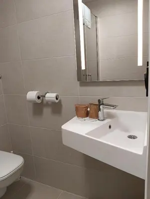 Salle de bains dans l'établissement Abalys Hotel