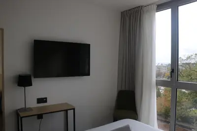 Télévision ou salle de divertissement dans l'établissement Abalys Hotel
