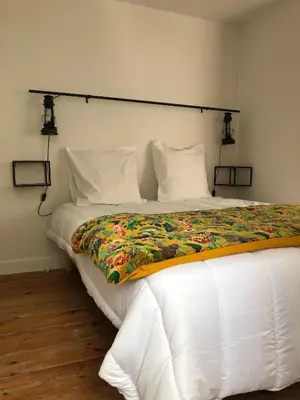 Un ou plusieurs lits dans un hébergement de l'établissement hotel de Croix