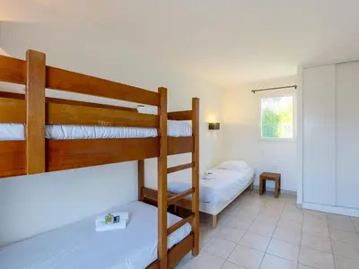 Un ou plusieurs lits dans un hébergement de l'établissement Vacancéole - Résidence Les Terrasses de Pentrez-Plage
