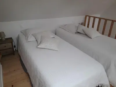 Un ou plusieurs lits dans un hébergement de l'établissement Gîte, Le Jardind'Eneour, spots de surf, plages et randonnées !