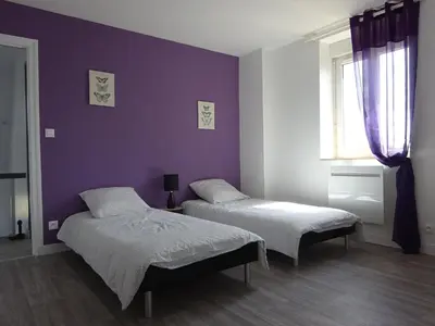Un ou plusieurs lits dans un hébergement de l'établissement Gîte de la Roche - Grande maison bretonne
