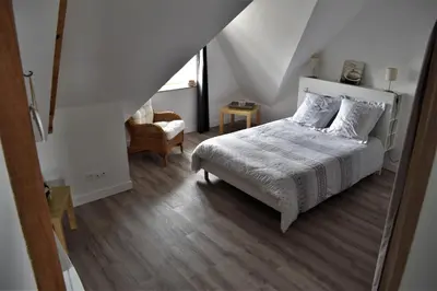 Un ou plusieurs lits dans un hébergement de l'établissement Gîte de la Roche - Grande maison bretonne