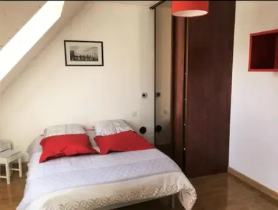 Un ou plusieurs lits dans un hébergement de l'établissement Maison proche bord de mer