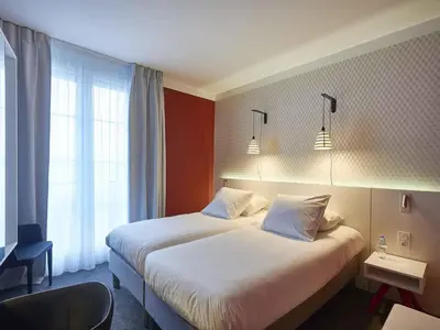 Un ou plusieurs lits dans un hébergement de l'établissement Hotel Mercure Brest Centre Les Voyageurs