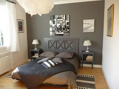 Un ou plusieurs lits dans un hébergement de l'établissement Charmante maison vue mer