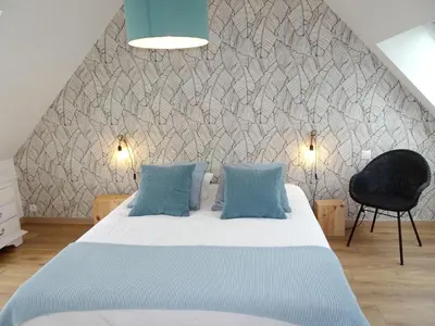Un ou plusieurs lits dans un hébergement de l'établissement Maison charmante avec vue sur la mer à Locquirec