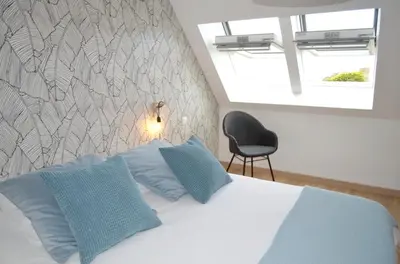 Un ou plusieurs lits dans un hébergement de l'établissement Maison charmante avec vue sur la mer à Locquirec