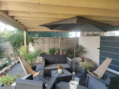 Coin salon dans l'établissement TY SAM BELLE MAISON MODERNE 8 à 10 personnes - PROCHE plages et commerces
