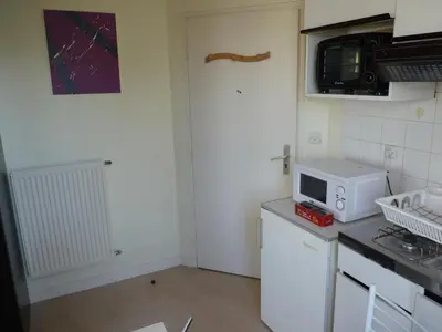 Cuisine ou kitchenette dans l'établissement Résidence Honoré de Balzac