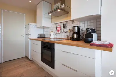 Cuisine ou kitchenette dans l'établissement Aux 4 Sardines T2 56m2