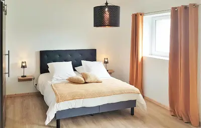 Un ou plusieurs lits dans un hébergement de l'établissement Lovely Home In Guisseny