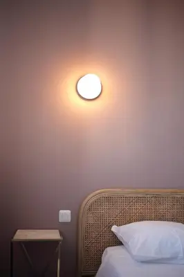 Un ou plusieurs lits dans un hébergement de l'établissement Hotel Saint Louis
