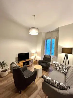 Télévision ou salle de divertissement dans l'établissement La Palmeraie - Appartement classé 4 étoiles - Hyper centre ville