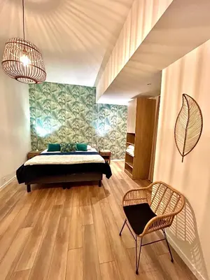 Un ou plusieurs lits dans un hébergement de l'établissement La Palmeraie - Appartement classé 4 étoiles - Hyper centre ville