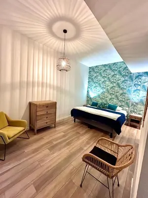 Coin salon dans l'établissement La Palmeraie - Appartement classé 4 étoiles - Hyper centre ville